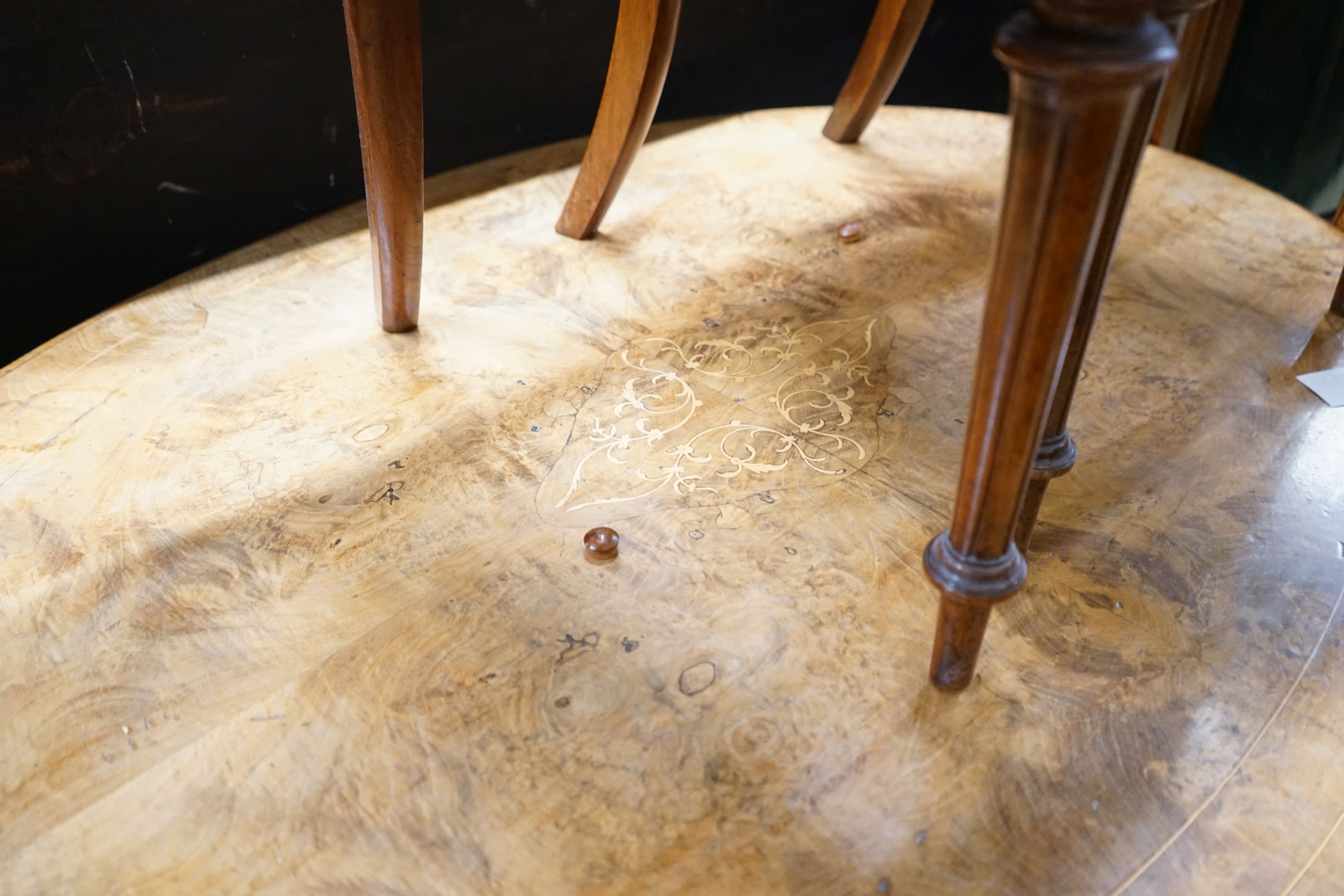 A Victorian burr walnut oval topped loo table, width 120cm, depth 85cm, height 70cm together with four Victorian walnut dining chairs (5)